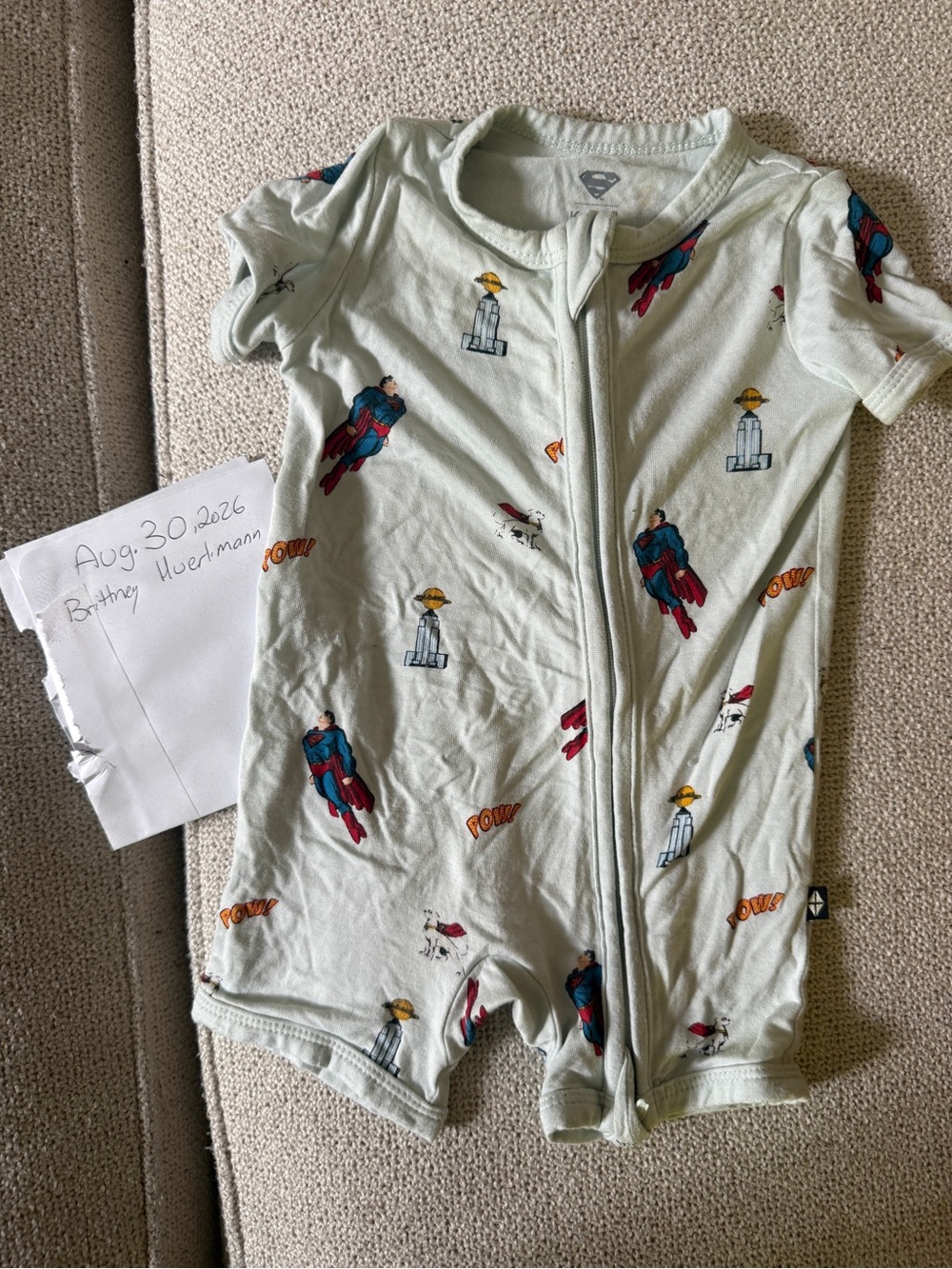 Kyte BABY Light Green Short Sleeve One-Piece with Superman Print